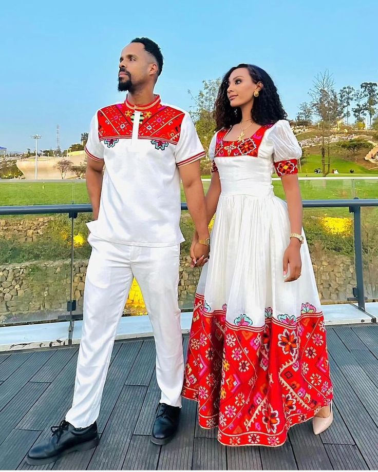 Description Celebrate your love in style with our vibrant Habesha couples outfit, perfect for weddings or special occasions. The striking red design, crafted from high-quality Menen fabric and comfortable cotton material, radiates passion and tradition. This coordinated set embodies the essence of Habesha weddings, seamlessly blending cultural richness with contemporary elegance. Make a bold statement as a couple with this enchanting Habesha outfit, showcasing the timeless beauty of Ethiopian tr Ethiopian Dress, Couples Outfit, Diy Skirt, Traditional Clothes, Red Design, British Indian, Wedding Poses, Caicos Islands, Handmade Home