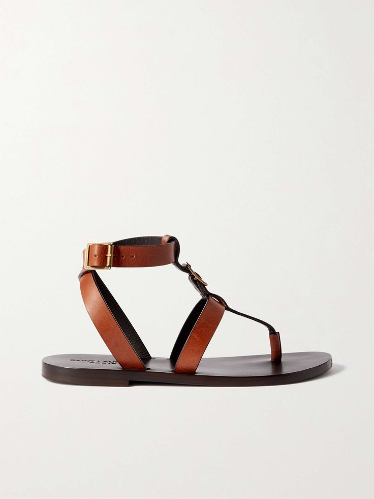 Elegant Leather T-strap Sandals For Vacation, Leather Sandals With Single Toe Strap And Leather Lining, Leather T-strap Flat Heel Sandals, Leather Sandals With Leather Lining And Single Toe Strap, Leather Toe Ring Sandals With Flat Heel, Chic Leather T-strap Sandals With Round Toe, Leather Ankle Strap Sandals With Leather Footbed, Leather Flat Footbed Sandals For Vacation, Designer Open Toe Sandals With Leather Footbed