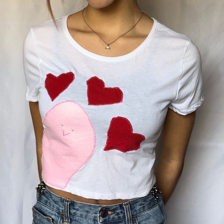 This super cute, lightweight, unique Baby Tee is perfect for everyday outfits! Design is hand-sewn onto a blank top by me. If you're looking for a fun and unique top, this shirt is perfect for you! Only 1 available! 💗Free 3 day US shipping  💗Handmade & One of a kind 💗52% cotton + 48% polyester  Sizing: Height: 17.5"    Chest: 17" CARE INSTRUCTIONS: Wash inside out, machine wash warm, tumble dry low, medium iron.  💗You may also like💗 Halleys comet baby tee: https://www.etsy.com/listing/13263 Cute Fitted T-shirt With Heart Graphic, Fitted Pink T-shirt With Heart Graphic, Fitted Patchwork T-shirt For Spring, Playful Cropped Tops For Spring, Cute Cropped Cotton T-shirt, Fitted Heart Graphic Crop Top For Summer, Fun Cotton Crop Top For Spring, Y2k Heart Print Top For Spring, Spring Cotton Patchwork T-shirt