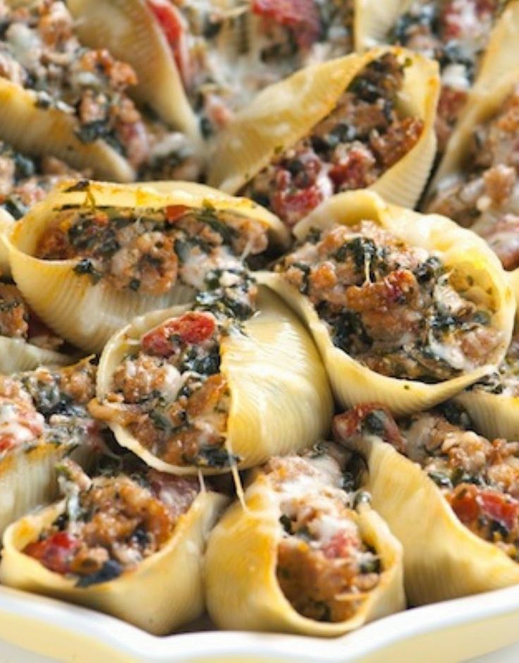 stuffed shells filled with meat and sauce in a casserole dish, ready to be eaten