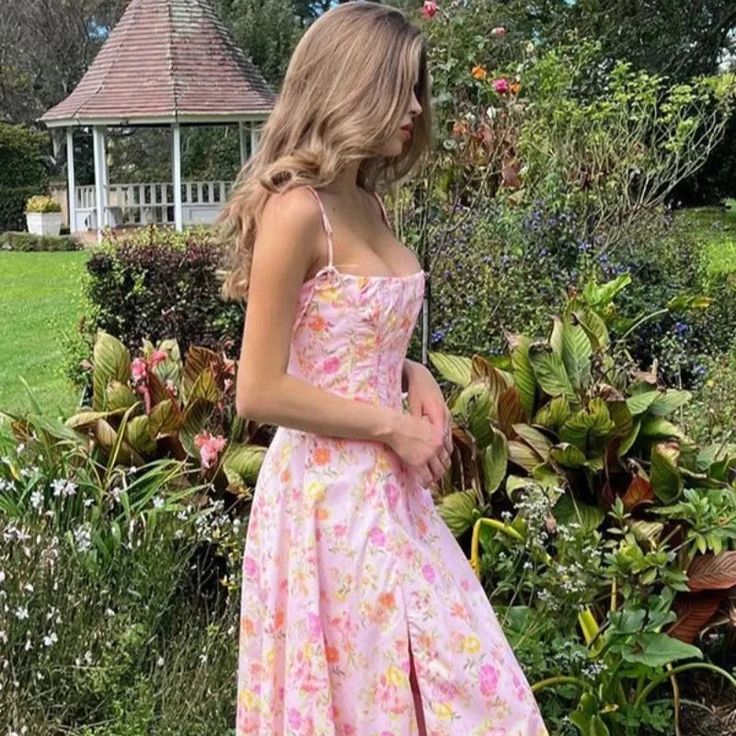 The beautiful floral print is part of what makes our 'Clarabelle' dress feel so romantic. It's cut from stretch cotton-rich fabric in a pink meadow print for a warm Spring and Summer like feel. 'Clarabelle' has a pretty trim to the corseted bodice that cinches and defines your waist perfectly. Feminine Floral Dress With Rose Print For Garden Party, Pink Ditsy Floral Dress For Garden Party, Pink Ditsy Floral Print Dress For Garden Party, Pink Dresses With Ditsy Floral Print For Garden Party, Feminine Pink Dress For Garden Party, Feminine Pink Cotton Floral Dress, Pink Feminine Floral Dress With Ditsy Print, Feminine Pink Floral Dress With Ditsy Print, Pink Dresses With Ditsy Floral Print For Brunch