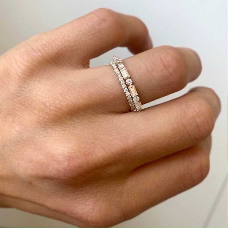 Item Details: Four baguette diamonds approx. 0.37 ctw. (G/VS). Five round diamonds approx. 0.15 ctw. (G/VS). Cast in your choice of 14K white, yellow, rose gold or platinum. Please allow 1-2 weeks for production and delivery. White Gold Cubic Zirconia Ring With Baguette Diamonds, Diamond White Rings With Baguette Lab-grown Diamonds, Diamond White Baguette Lab-grown Diamond Rings, Diamond White Baguette Diamond Rings In Lab Grown Diamond, Moissanite Ring With Baguette Diamonds, Moissanite Rings With Baguette Diamonds In Diamond White, Fine Jewelry Diamond White Ring With Baguette Diamonds, Moissanite Baguette Diamond Rings In Diamond White, Silver Baguette Diamond Rings