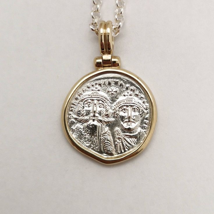 Byzantine-era coins were believed to be talismans against evil spirits, their mystical energy would give prosperity and luck to the one wearing them. It was a common practice to give such coins as gifts to newborns to protect them. This is a special statement piece, a hand-forged solid 14k yellow gold frame holds a solid sterling silver coin, exact copy of the ancient one, and hangs from a silver chain creates an ideal layering necklace. Elegant, classy, boho, classic and modern at the same time White Gold Byzantine Jewelry Hallmarked, Byzantine Coin Pendant Jewelry, Byzantine Round Coin Pendant Jewelry, Byzantine Style Round Coin Pendant Jewelry, Silver Byzantine Jewelry In 14k Gold, Silver Byzantine Necklace, Byzantine Round Hallmarked Jewelry, Handmade Sterling Silver Byzantine Jewelry, Handmade Byzantine Style Sterling Silver Jewelry