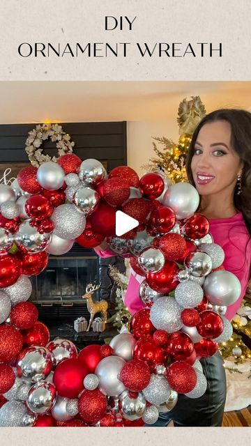 a woman standing in front of a christmas wreath with ornaments on it and the words diy ornament wreath