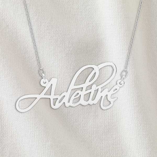 Engraved with any nameChoose chain lengthPlease Note - This product takes an additional 1-2 business days on top of standard production timeConstructed of sterling silverName measures approximately 1.5-2" W x .5" HMade in USA  Give her a one-of-a-kind gift with the Personalized Fancy Script Name Necklace, perfect for Mother's Day, a birthday and many other occasions! Personalized Stainless Steel Jewelry For Anniversary, Personalized White Gold Stainless Steel Jewelry, Sterling Silver Signature Jewelry For Personalized Gift, Custom Name Silver Jewelry In Stainless Steel, Classic Silver Engraved Necklace, Silver Stainless Steel Custom Name Jewelry, Minimalist Sterling Silver Name Necklace For Formal Occasions, Elegant Stainless Steel Name Necklace For Personalized Gift, Elegant Stainless Steel Name Necklace As Personalized Gift