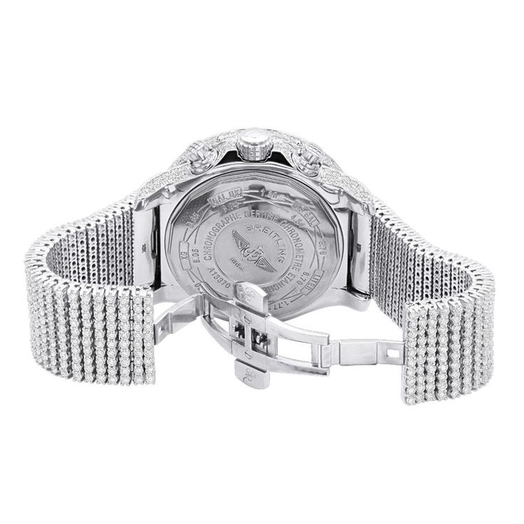 Introducing the Breitling Super Avenger diamond watch for men. This luxurious timepiece is crafted with a stainless steel case and bezel and is adorned with 35 carats of white diamonds. The bezel is made of stainless steel and is silver in color, while the bracelet is crafted from 10K gold and is white in color. The dial is white and features a scratch-resistant window, while the hands and markers are silver-tone. The watch is powered by an automatic movement and features a chronograph, date ind Luxury Cubic Zirconia Watch For Anniversary, White Gold Diamond Watch With Cubic Zirconia Accents, Luxury Iced Out Diamond Watch, Luxury White Diamond Watch Iced Out, Luxury Diamond White Watch Iced Out, Luxury Diamond White Watch With Cubic Zirconia, Luxury Iced Out Cubic Zirconia Watches, Luxury Silver Watch With Diamond Accents, Luxury Silver Watches With Diamond Accents