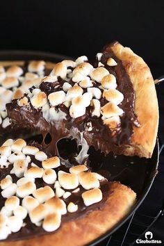 there is a chocolate pizza with marshmallows on it