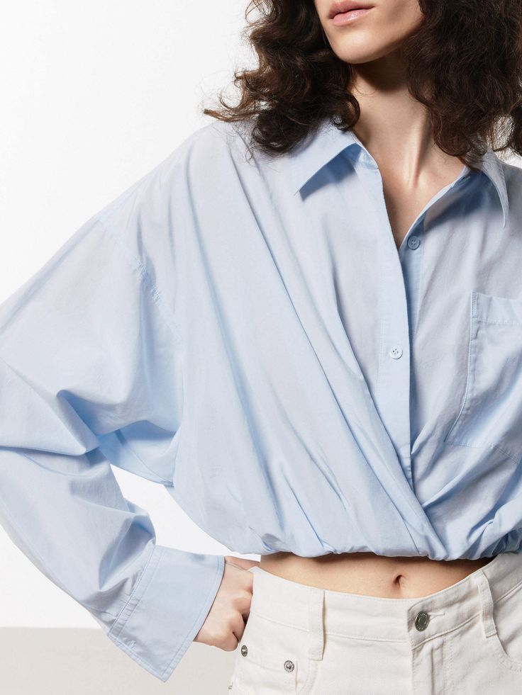 MO&Co. Women's Cotton Silk Cropped Shirt Offered in a soft blue and white hue, this shirt is made with a comfortable blend of cotton and silk. It's shaped in a cropped silhouette and stretchy hem for a stylish yet comfortable fit. Perfectly pairs with high-waisted shorts or pants. Features : - Regular fit, cropped- Elasticised hem, pointed collar- Soft touch, made from cotton and silk Code: MBD2SHTT53The back length of size S is 52cmMATERIALS & CARE Material: 59.1% Cotton 40.9% SilkREMINDER: All Cropped Shirt, Crop Shirt, Cotton Silk, High Waisted Shorts, Comfort Fit, Blue And White, High Waisted, Silk, Collar