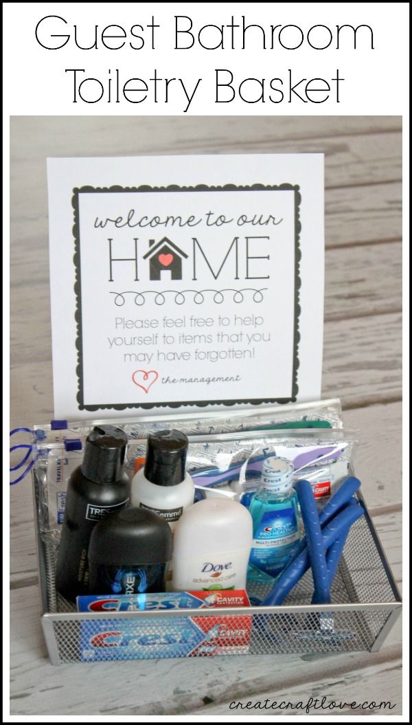 the guest bathroom toiletry basket is organized and ready to be used