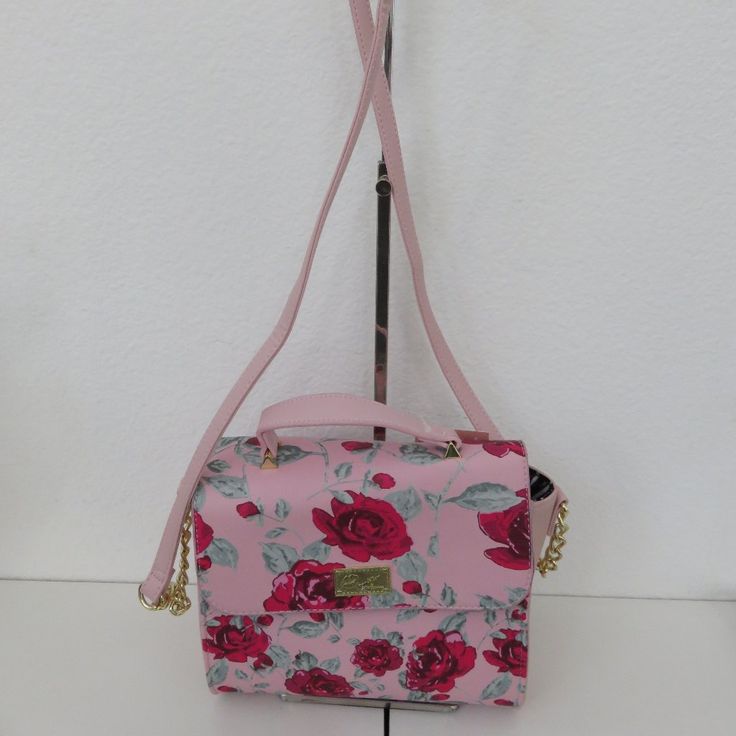 New With Tag Floral Flower Roses Pink With Pink Red Flowers Hand Bag Purse Chain Strap Inside Zip Pocket Two Inside Slip Pockets Fold Over Magnetic Closure Top Carry Handle Crossbody Strap Shoulder Bag Approximately W- 8.5” Inches X H- 7” Inches X D- 4” Inches Questions? Leave A Comment Below! Feminine Pink Crossbody Satchel, Chic Pink Satchel For Summer, Chic Pink Summer Satchel, Summer Pink Satchel With Removable Pouch, Summer Pink Satchel With Detachable Strap, Chic Satchel With Floral Print, Pink Floral Print Bags For Summer, Feminine Pink Crossbody Bag, Chic Floral Print Satchel Bag