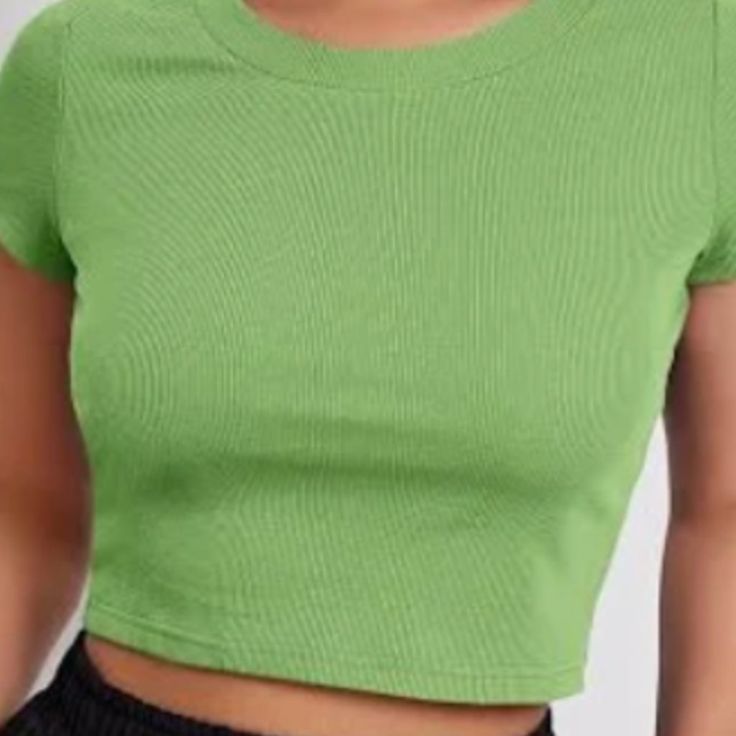 Lime Green One Size: S-Xl A Seamless Ribbed Knit Shirt Featuring A High Neckline Made In The U.S. Trendy Green Ribbed T-shirt, Basic Green Stretch Crop Top, Solid Ribbed Stretch Top, Ribbed Solid Stretch Tops, Solid Stretch Ribbed Tops, Stretch Solid Ribbed Top, Basic Ribbed Stretch Tops, Basic Stretch Ribbed Tops, Basic Green Crop Top