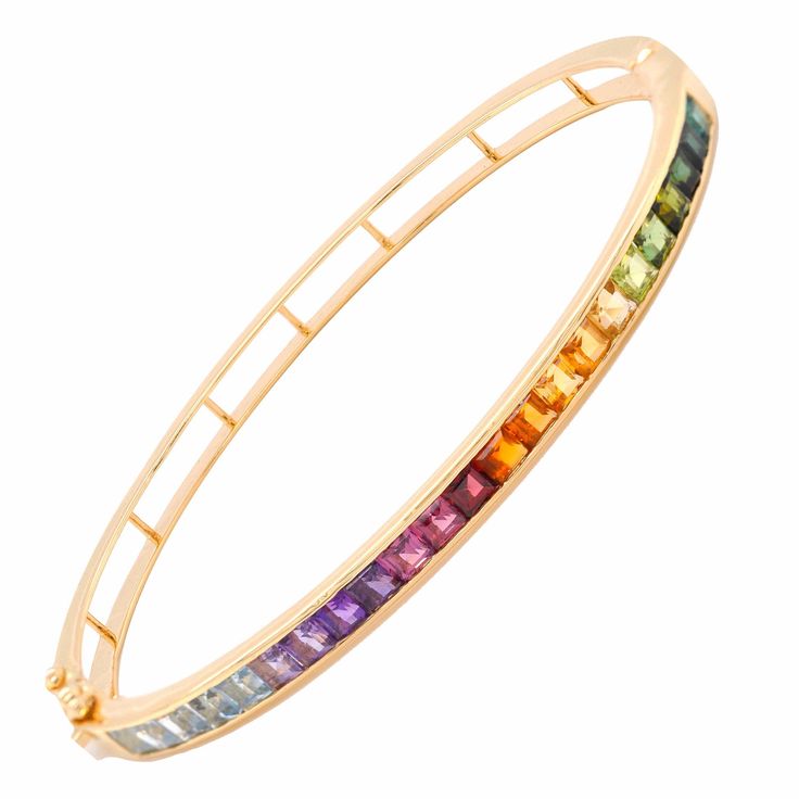 Discover the enchantment of the Multicolor Rainbow Channel Set Bracelet, a true embodiment of vibrant sophistication that celebrates nature's myriad of colors. This design pays homage to the beauty of diversity, presenting carefully chosen gemstones cradled within a seamless channel setting, resulting in a mesmerizing array of brilliant hues. Elegant Rainbow Colored Bangle Jewelry, Luxury Multicolor Gemstone Bracelets, Elegant Rainbow Multi-stone Bracelets, Rainbow Multi-stone Bracelet Jewelry, Rainbow Multi-stone Bracelet, Set Bracelet, Rainbow Gemstones, The Enchantments, Channel Setting