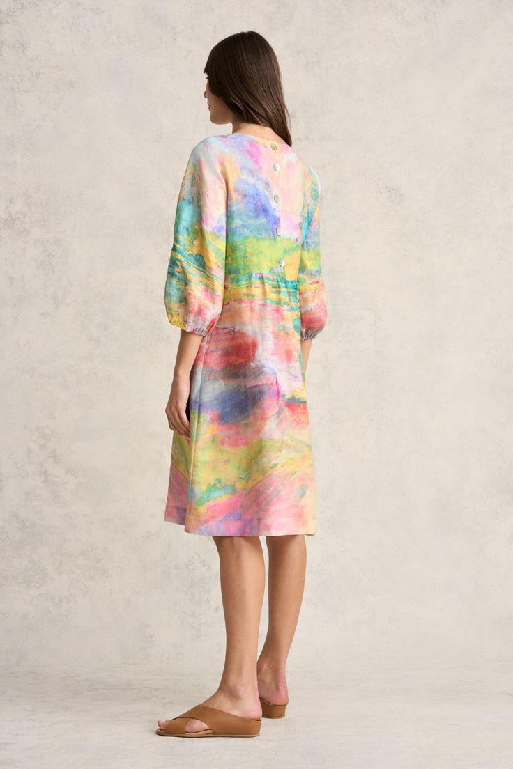 Featuring pastel tones that come together to create a stunning Abstract Landscape print, this midi-length dress is a celebration of spring. Crafted from 100% French linen, it showcases beautiful top stitch detailing along the neckline and chic button back fastening. Perfect for warmer weather, this piece is breathable, comfortable and joyous. Feminine Multicolor Midi Dress For Garden Party, Feminine Multicolor Knee-length Dress, Multicolor Print Midi Dress For Spring Garden Party, Multicolor Midi Dress For Spring Garden Party, Feminine Multicolor Knee-length Midi Dress, Spring Multicolor Print Long Sleeve Midi Dress, Spring Long Sleeve Multicolor Print Midi Dress, Long Sleeve Multicolor Print Midi Dress For Spring, Feminine Multicolor Midi Dress