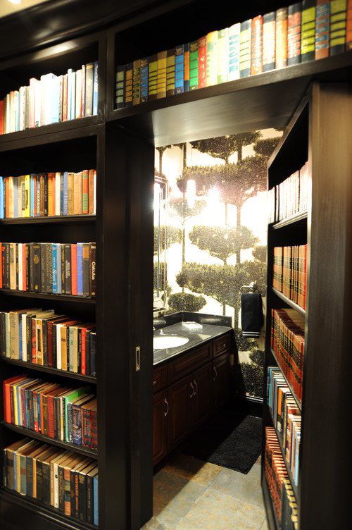 an open bookcase with many books on it and a sink in the corner next to it