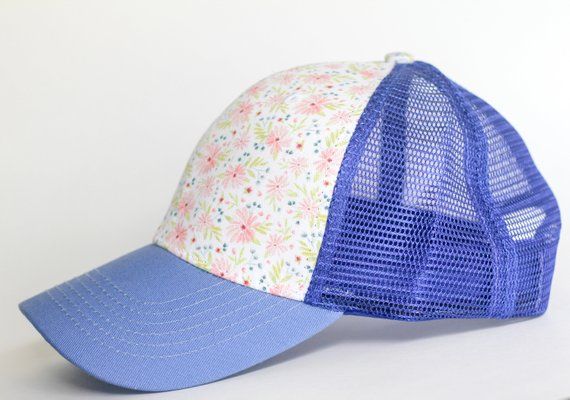 Pretty, fun, and comfortable hat for girls and moms! This sweet floral pattern makes this trucker hat perfect for the ladies and kids that love to wear a trucker hat, but don't want words, logos, or characters on their hats!Size is 21 3/4 in, 54 cm, size 6 3/4. Fits toddlers to small adult. Spring Floral Print Cap, Casual Floral Print Cap, Playful Spring Trucker Hat With Curved Brim, Cute Spring Trucker Hat With Curved Brim, Playful Snapback Trucker Hat For Spring, Blue Snapback Trucker Hat For Spring, Playful Spring Baseball Cap, One Size Fits Most, Playful Pink Trucker Hat For Spring, Blue Fun Trucker Hat For Spring