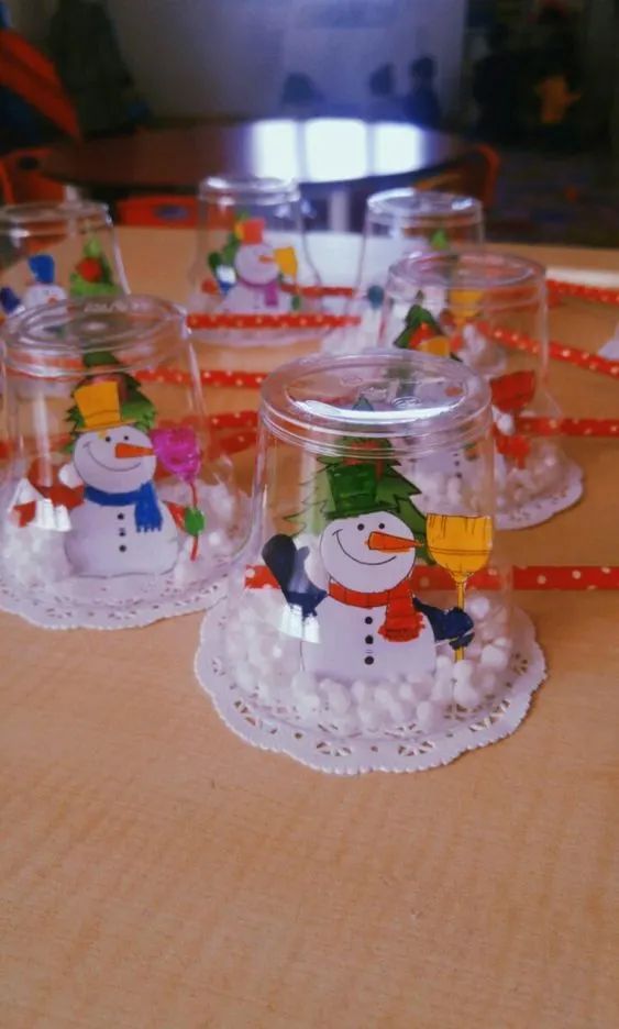 some glass cups with snowmen on them