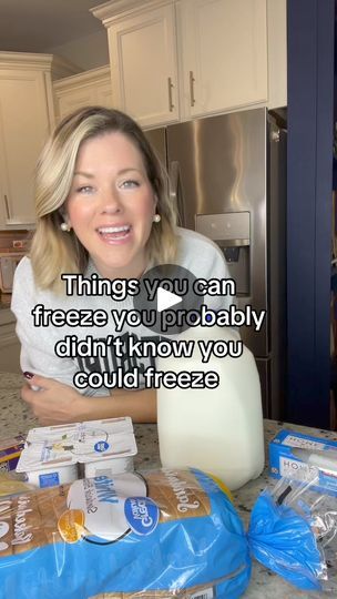 a woman sitting at a kitchen counter with milk in front of her and the words, things you can freeze you probably didn't know you could