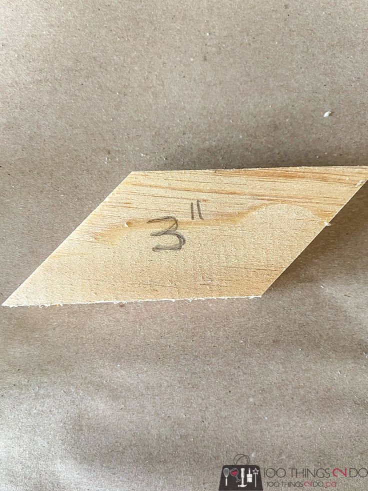 a piece of wood with the number thirteen on it