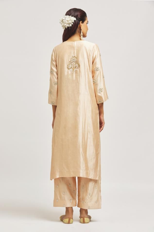 Beige pure spun silk kurta with zardosi hand embroidery. Comes with pant and a pure organza dupatta.
Components: 3
Pattern: Hand embroidered
Type Of Work: Zardosi
Neckline: Round
Sleeve Type: Three quarter
Fabric: Pure spun silk, Dupatta: Pure organza
Color: Beige
Other Details: 
Side slits on kurta
Embroidered borders on dupatta
Occasion: Mehendi and Haldi - Aza Fashions Raw Silk Palazzo Set With Zari Work For Reception, Tussar Silk Palazzo Set For Festivals, Unstitched Palazzo Set With Zari Work In Raw Silk, Zari Work Straight Kurta Palazzo Set For Reception, Art Silk Palazzo Set With Chikankari Embroidery, Straight Kurta Palazzo Set With Zari Work For Reception, Festive Tussar Silk Palazzo Set With Cutdana, Semi-stitched Raw Silk Palazzo Set For Reception, Festive Palazzo Set With Cutdana In Tussar Silk