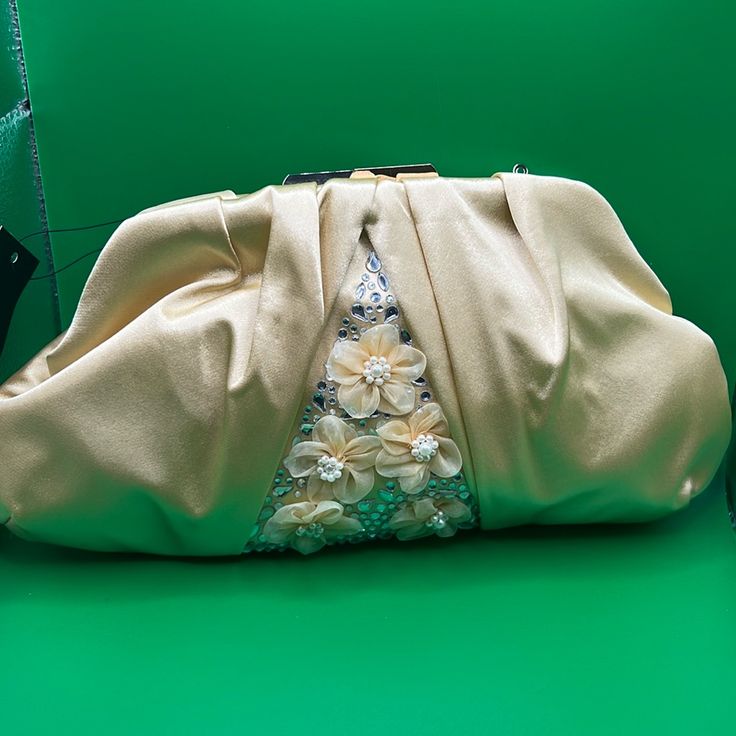 This Beautiful Satin Bag Comes With A Gold Chain Strap. The Gold Kiss-Lock Makes Any Bag An Eye Catcher Nwt Cream Bags For Spring Party, Elegant Cream Clutch For Party, Cream Clutch Shoulder Bag For Party, Cream Party Clutch Shoulder Bag, Cream Shoulder Bag For Evening In Spring, Cream Shoulder Bag For Evening, Cream Shoulder Bag For Spring Evening, Chic Beige Embellished Clutch, Chic Beige Embellished Evening Bag