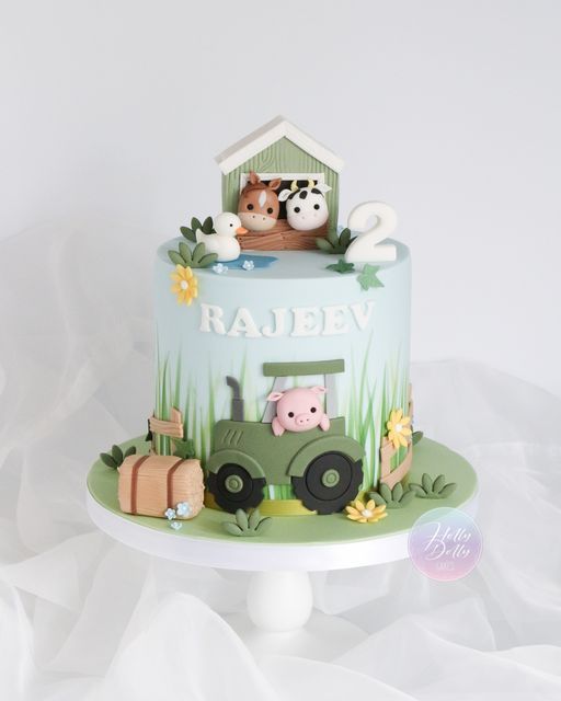 a birthday cake with farm animals on top