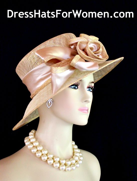 Ladies Metallic Gold And Champagne Beige  Wide Brim Sinamay Straw Designer Fashion Church Wedding Hat. The Bow Can Be Worn Toward The Front Of The Face Or Toward The Back Of The Head. This Dress Hat Is Suited For Weddings, Formals, Bridal, Mother Of The Bride, The Kentucky Derby, The Melbourne Cup, The Royal Ascot,  And Horse Races.

Measurements: Crown Measures 22.5".  This lovely headpiece is suited for Spring, Summer or Early Fall.

All Sales Are Final. Classic Straw Hat For Spring Wedding, Classic Mini Hats For Spring Wedding, Vintage Straw Hat For Spring Wedding, Classic Spring Wedding Straw Hat, Vintage Spring Wedding Straw Hat, Classic Brimmed Mini Hat For Wedding, Classic Adjustable Straw Hat For Weddings, Fitted Beige Straw Hat For Parties, Classic Beige Hat For Wedding