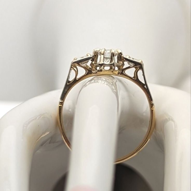 a close up of a ring on top of a white object