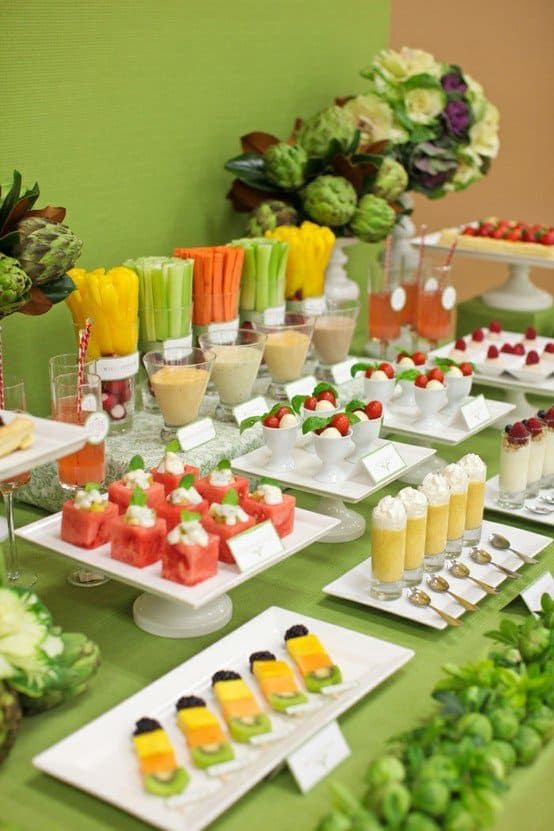 a table filled with lots of different types of food and drinks on plates next to each other