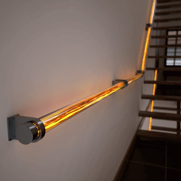 a light that is on the side of a wall next to a stair case in a house