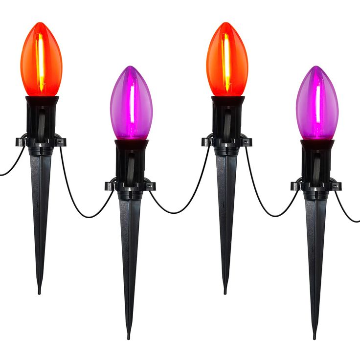 three purple and orange lights are connected to each other with black poles on the ends