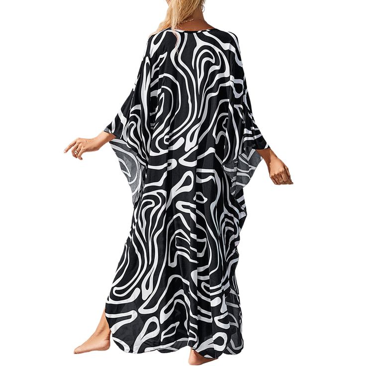 Wavy White Print Long Kinimo Beachwear Black Flowy Cover-up For Vacation, Flowy Black Cover-up For Vacation, Casual Long Sleeve Swimwear For Vacation, Casual Beach Kaftan For Beach Season, Printed Relaxed Fit Swimwear For Beach, Casual Kaftan With Relaxed Fit For Vacation, Casual Printed Swimwear For Holiday, Casual Kaftan For Beach Party, Flowy Casual Kaftan For Beach Party