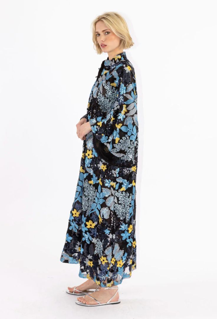 Slip on our signature caftan silhouette for an effortless look that feels refined. this caftan features sequin embroidered florals in blue hues, with golden florals peeping throughout. handmade. banded collar. bell sleeves. bust: 50", hem opening: 69", sleeve opening: 38", body length: 51" four button placket. dry clean. see-through. pictured with undergarments. sales promotions not applicable to outside partners. Model is 5'9" / 175cm. this item is only available in one size. Floral Print Long Sleeve Kaftan For Daywear, Blue Floral Print Long Sleeve Kaftan, Blue Long Sleeve Kaftan With Floral Print, Spring Evening Embroidered Kaftan, Blue Long Sleeve Kimono With Floral Embroidery, Blue Evening Kaftan For Spring, Blue Kaftan For Spring Evening, Blue Kaftan For Evening In Spring, Hemant And Nandita