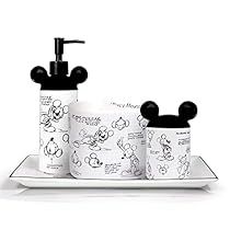 the mickey mouse soap dispenser is next to three cups on a plate