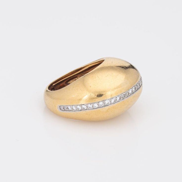 Rare vintage Tiffany & Co diamond dome ring designed by Paloma Picasso, crafted in 18 karat yellow gold & platinum (circa 1980).    33 round brilliant & single cut diamonds total an estimated 0.33 carats (estimated at G-H colour and VS2-SI1 clarity).  Dating to 1980 the 18k gold dome ring, with a central strand of diamonds, is designed by Paloma Picasso for Tiffany & Co, the same year she started her design work at Tiffany (and continues today). Paloma Picasso has a love of big gemstones and bol Yellow Gold Dome Ring With Brilliant Cut Diamond, Timeless Gold Dome Ring With Diamond, Luxury Domed Gold Diamond Ring, Yellow Gold Dome Ring With Rose Cut Diamonds, Gold Domed Ring With Brilliant Cut, Yellow Gold Dome Ring With Diamond Accents, Gold Dome Ring With Single Cut Diamonds, Luxury Yellow Gold Dome Ring With Brilliant Cut, Anniversary Yellow Gold Dome Ring With Diamonds