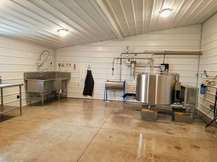 a room filled with lots of stainless steel equipment