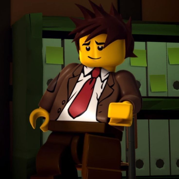 a lego man in a suit and tie standing next to a shelf with binders on it