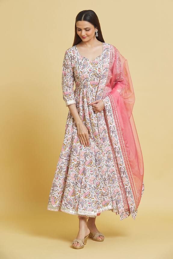 Baby pink cotton anarkali with lotus print and gota embroidered borders. Comes with pant and an organza dupatta.
Components: 3
Pattern: Printed, Embroidered
Type Of Work: Lotus, Gota
Neckline: Leaf Neck
Sleeve Type: Three quarter
Fabric: Cotton, Dupatta: Organza
Color: Pink
Other Details: 
Closure: Anarkali and Pant - Drawstrings
Occasion: Mehendi and Haldi - Aza Fashions Cotton Anarkali Set With Printed Motifs For Wedding, Bollywood Anarkali Set With Kalamkari Print For Diwali, Semi-stitched Kalamkari Print Bollywood Anarkali Set, Unstitched Bollywood Anarkali Set With Kalamkari Print, Anarkali Salwar Kameez With Kalamkari Print For Diwali, Cotton Traditional Wear With Printed Motifs For Wedding, Pink Cotton Anarkali Set For Festivals, Bollywood Anarkali Set With Kalamkari Print, Transitional Designer Cotton Anarkali Set