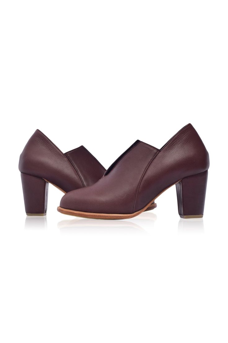 The Ange ankle booties are a must-have for your desk-to-dinner look with the below-ankle height design and leather-wrapped heel. Handcrafted in a timeless silhouette, neutral hues, and almond-shaped toe, these booties are comfortable and chic enough to become your favourite pair for any occasion. Wear them with your mini or midi dress to elevate your everyday casual look or with your skinny jeans for a super chic style. 100% genuine leather Smooth leather lining and insole with embossed logo Lig Heels Brown, Leather Colors, Leather Weekender Bag, Brown Leather Heels, Wrap Heels, Brown Booties, Boho Leather, Wooden Heel, Leather High Heels