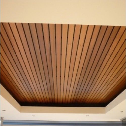 a ceiling with wooden slats in an empty room