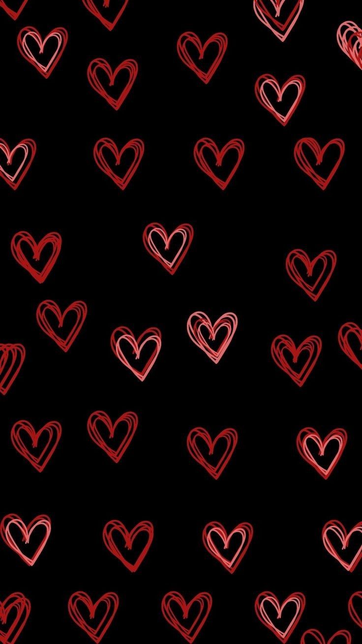 red hearts drawn on a black background