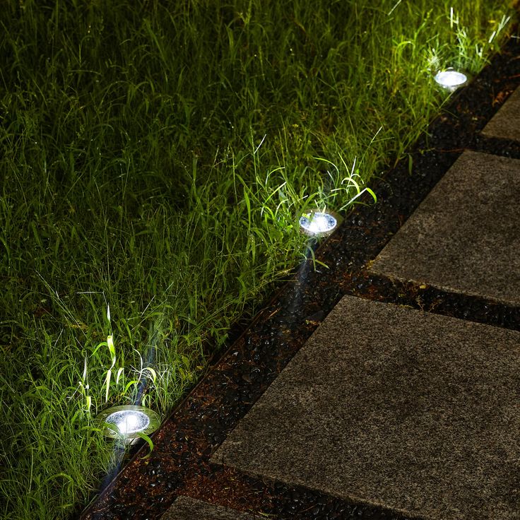 some lights that are sitting in the grass