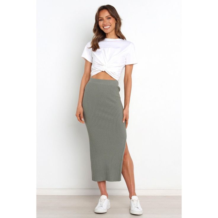 Make a fashion statement in this must-have midi-length skirt! Crafted from stretch ribbed knit for an easy fit, its elasticized waistband ensures maximum comfort and style. With a side split feature to show off your legs, you'll be sure to turn heads when you wear it. Chic Ribbed Midi-length Bottoms, Chic Knit Skirt For Day Out, Chic Ribbed Midi Length Bottoms, Fall Ribbed Midi Skirt, Fall Ribbed Midi Length Skirt, Chic Knit Midi Skirt, Chic Ribbed Midi Skirt, Solid Color Chic Ribbed Skirt, Chic Knit Midi Bottoms