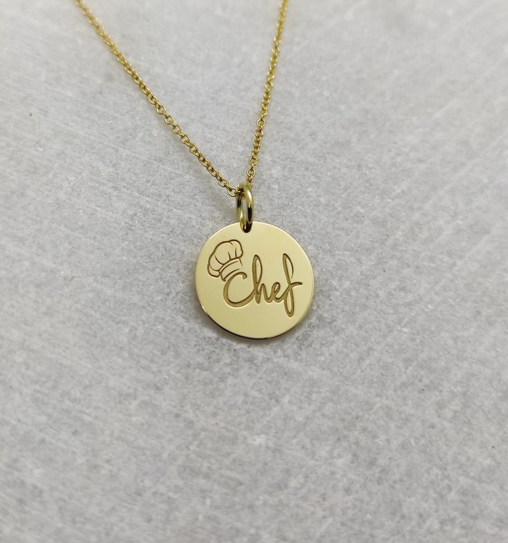 "Chef Necklace - Engraved Chef Charm - Gold Graduation Charm - Gold Cooking Pendant ▪️ A beautiful and clean engraved Chef pendant made out of 14K Solid Real Gold. Available only in yellow gold! Pendant Thickness: 0.65mm Jump Ring inner diameter: 4mm Dimensions - Small - 13x13mm / 0.51 x 0.51 inches Medium - 14x14mm / 0.55 x 0.55 inches Big - 15x15mm / 0.59 x 0.59 inches Necklace Length - You can choose your chain length from 35CM to 50CM. The pendant is available alone without a chain, select \ Custom Gold Sterling Silver Necklace With Polished Finish, Custom Yellow Gold Sterling Silver Round Pendant, Custom 14k White Gold Round Pendant Necklace, Personalized Nameplate Jewelry With Polished Finish, Gold Plated Pendant Charm Necklace With Polished Finish, Personalized Gold-plated Charm Necklaces, Personalized Round Gold Plated Charm Necklaces, Gold Polished Nameplate Jewelry, Personalized Gold Plated Charm Necklaces