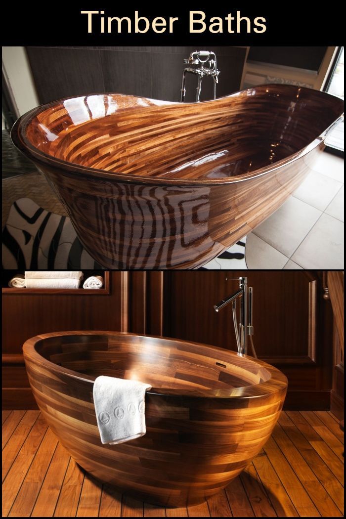 a wooden bathtub sitting on top of a hard wood floor