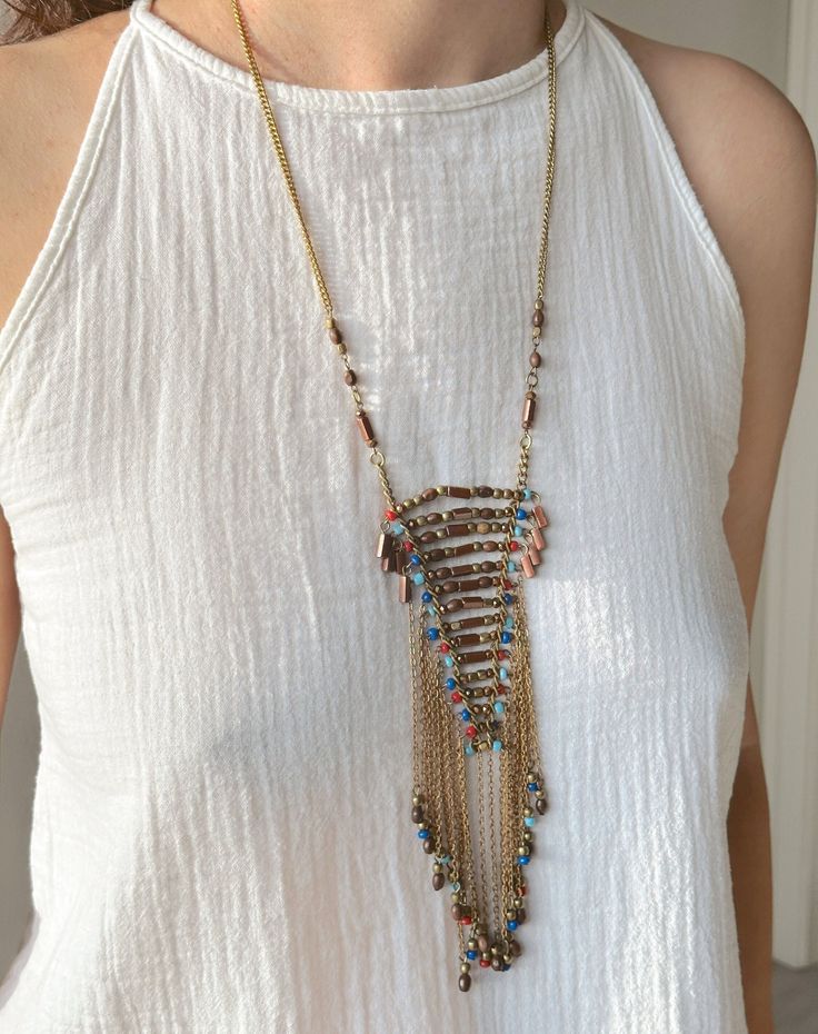 This Handmade Ethnic Necklace is a very unique beaded jewelry, which is going to be yours if you are here.  Its ethnicity and elegance comes from the traditional tribal ethnic design and boho minimalist string structure. It is designed and produced by local shaman artisans. Shamanism is known as a nature worship belief. Shamans bound their soul with nature. Our necklace is designed and is became alive with this bound. If you would like a distinctive, unique, ethnic and dainty necklace, Zoho Acce Bohemian Long Necklace For Festive Occasions, Bohemian Beaded Beads For Jewelry Making, Bohemian Necklace With Colorful Beads For Festive Occasions, Bohemian Long Necklace With Dangling Round Beads, Unique Long Beaded Necklaces With Dangling Beads, Unique Long Beaded Necklace With Dangling Beads, Festival Beaded Necklaces With Tassels And Round Beads, Long Beaded Festival Necklaces With Dangling Beads, Festival Long Beaded Necklaces With Dangling Beads