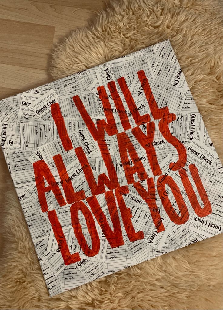 the words will always love you written in red on a piece of paper surrounded by letters