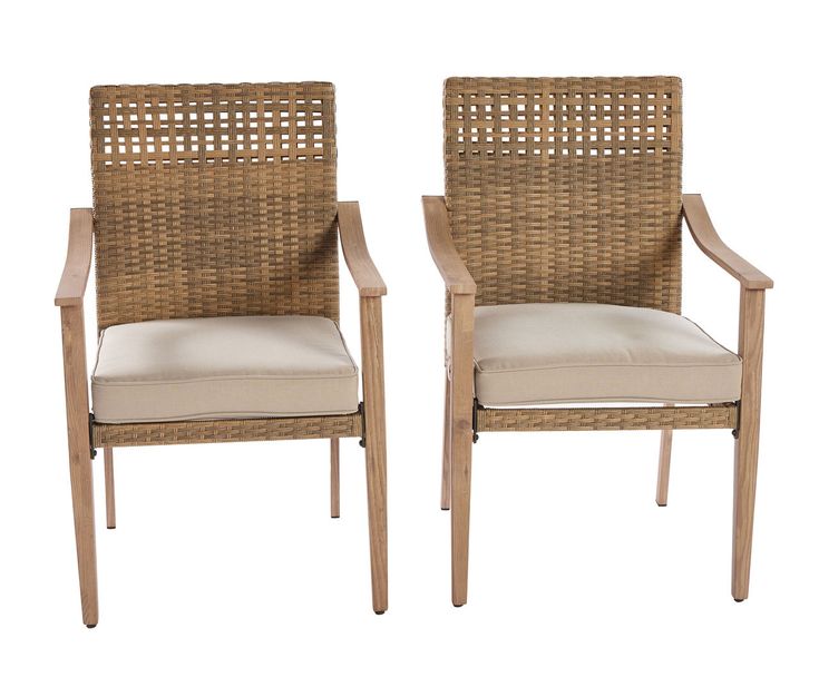 two wicker chairs sitting side by side