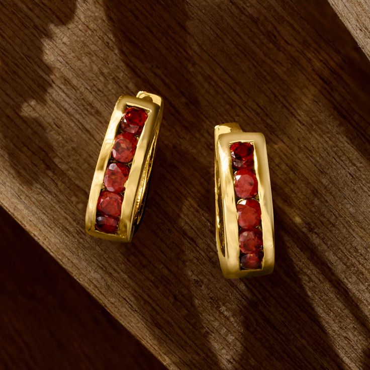 Ross-Simons - .90ct t. w. Garnet Huggie Hoop Earrings Over Sterling. 1/2". In a fresh cherry hue, .90 ct. t. w. round brilliant-cut garnets pop from the front of these versatile huggie hoop earrings. A fabulous, affordable pair, especially for the January-born, that you will wear so often! Crafted in polished 18kt yellow gold over sterling silver. Hanging length is 1/2". Hinged post, garnet huggie hoop earrings. Garnet birthstones are the perfect gift for January birthdays. Anniversary Clip-on Huggie Hoop Earrings, Red Hoop Jewelry For Formal Occasions, Classic Yellow Gold Hoop Earrings With Gemstone, Red Hoop Jewelry For Anniversary, Classic Gemstone Hoop Earrings For Anniversary, Red Huggie Earrings For Anniversary, Anniversary Clip-on Huggie Earrings, Red Small Hoop Jewelry For Anniversary, Small Hoop Huggie Earrings With Gemstones For Anniversary