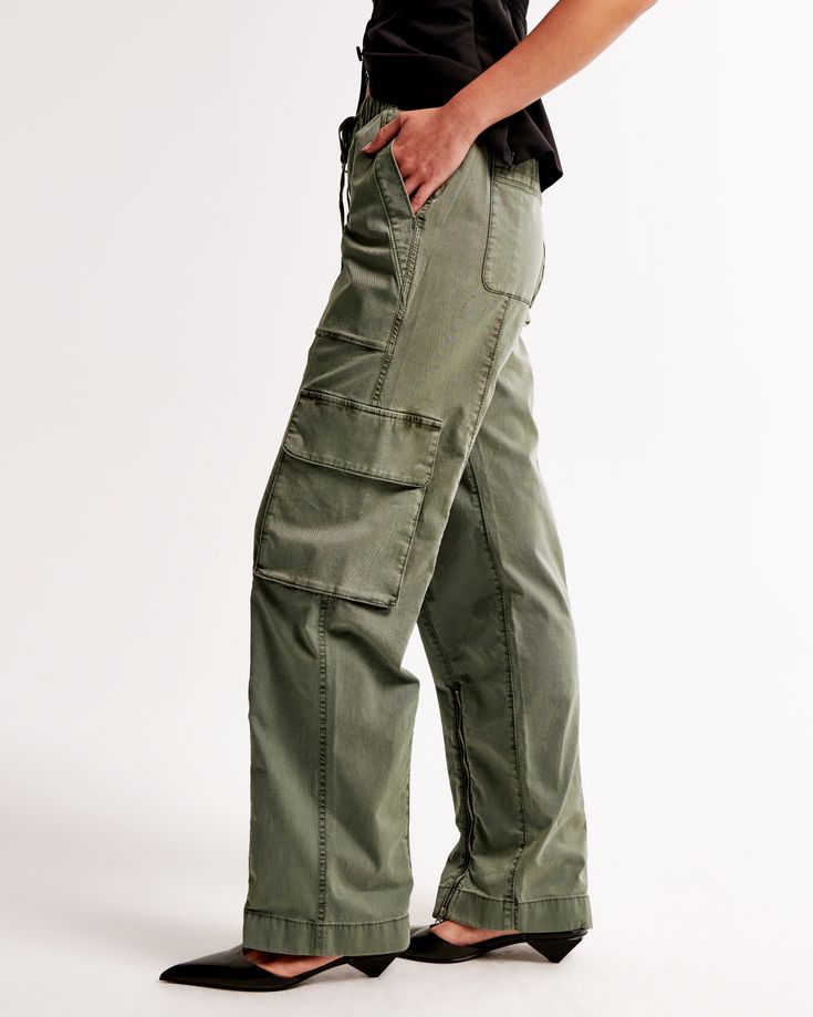 Elevate your casual wardrobe with the Abercrombie & Fitch Women's Baggy Cargo Pull-On Pant in a chic Olive shade. These versatile pants are designed to be worn high, mid, or low rise, adapting effortlessly to your style and comfort preferences.

- Size: XXS SHORT
- Color: Olive
- Material: Body - Cotton, Elastane; Pocket Bag - Cotton
- Gender: Female
- Style: Wide Leg Pants
- Features: High-rise with adjustable rise options, drapey twill fabric, all-over garment dye wash, baggy silhouette, cargo High Waist Casual Cargo Shorts With Pockets, Utility Cargo Bottoms With Relaxed Fit, Relaxed Fit Utility Bottoms For Fall, Utility Cargo Style Bottoms For Summer, Summer Utility Cargo Bottoms, High Waist Relaxed Fit Utility Bottoms, Spring Mid-rise Cargo Pants With Pockets, Utility Cargo Pants With Relaxed Fit And Hip Pockets, Utility Cargo Pants With Hip Pockets And Relaxed Fit