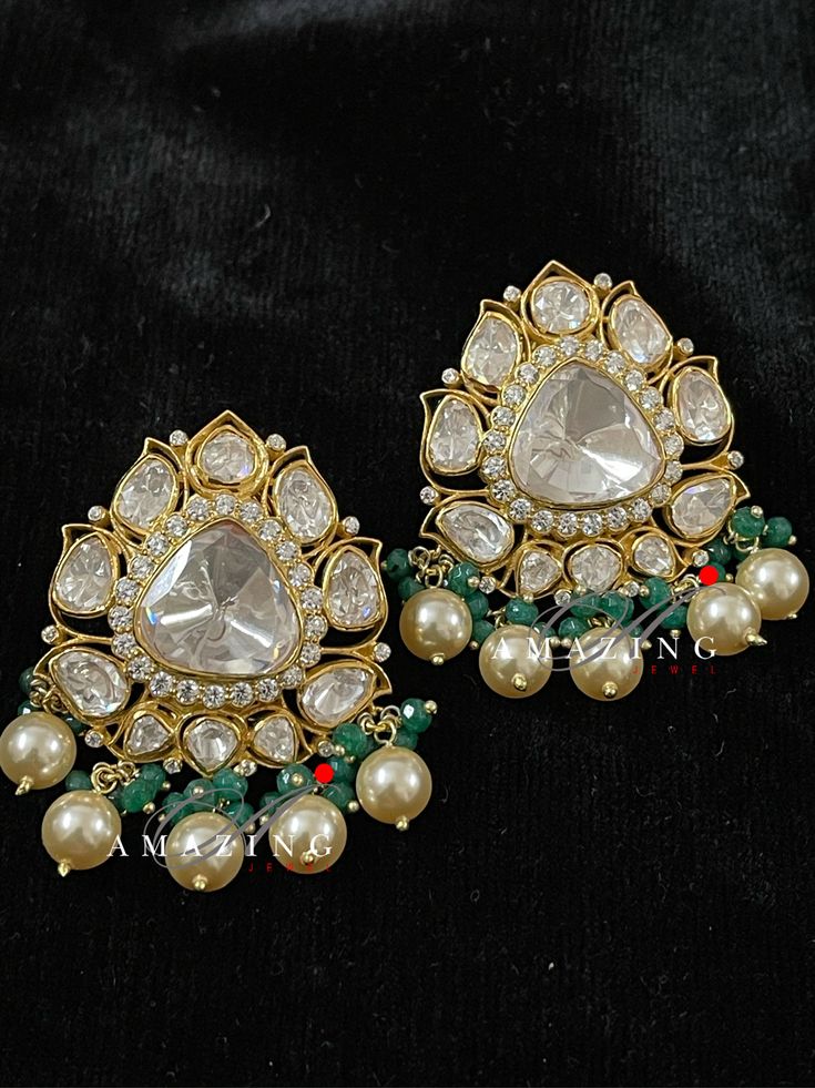 Silver Moissanite Polki Earring | Indian Wedding Jewelry | Indian Moissanite Polki Earring| Statement Earring Material : Silver Gemstone: Moissanite , Swarovski Stones & Fresh Water Sea Pearls Stone colour: Uncut Polki Primary colour: Gold Size-Length: 35mm Width: 25mm Closure : Screw back and Clips Silver Intricate, hand crafted, Pure Silver Polki Earrings, studded with high quality Moissanite Polki comes with screw back and clips, made in 92.5 silver with 22ct gold plating. Product comes w Polki Tops Earrings, Exquisite Green Diamond Earrings For Wedding, Fusion Style Gemstone Chandelier Earrings For Wedding, Exquisite Green Diamond Wedding Earrings, Teardrop Diamond Earrings With Gemstone For Weddings, Festive Gemstone Earrings For Wedding, Diamond Gemstone Dangle Earrings For Wedding, Traditional Green Diamond Earrings, Traditional Gemstone Chandelier Earrings For Weddings